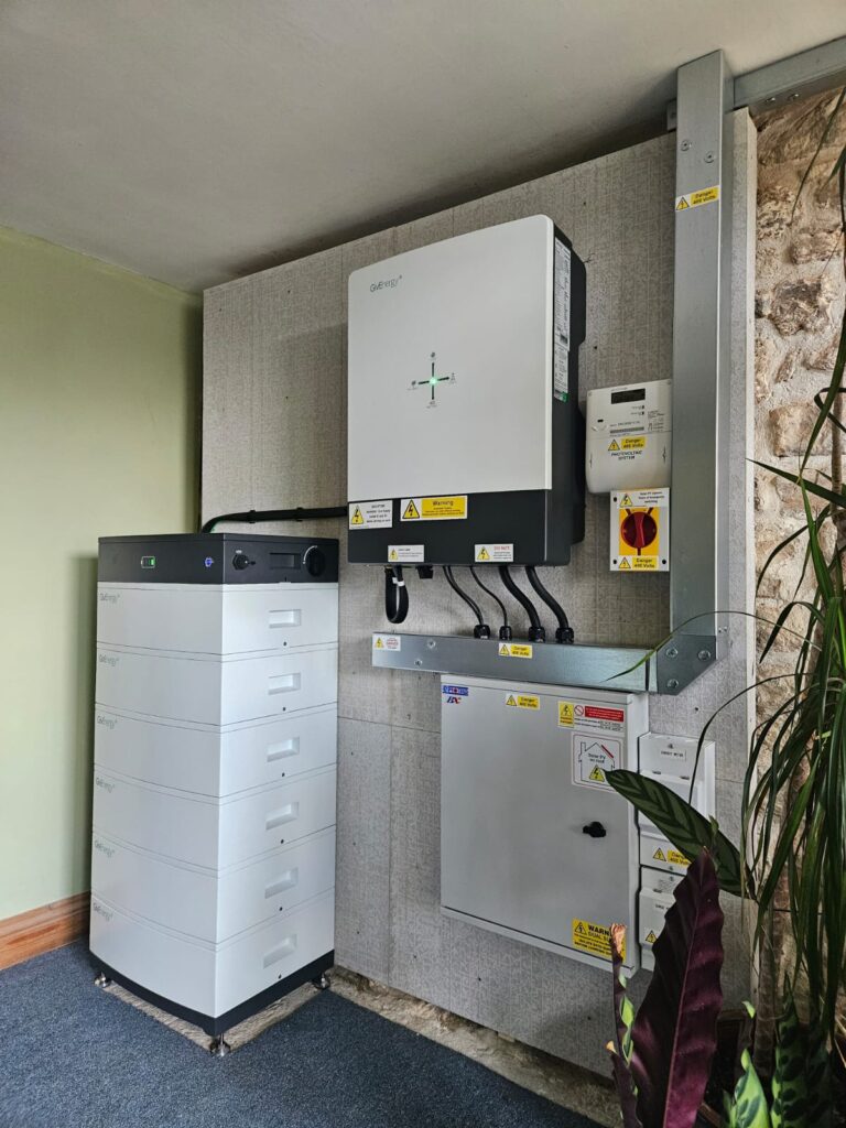 GivEnergy's 3-phase hybrid system, with inverter and batteries, installed in a customer's home.