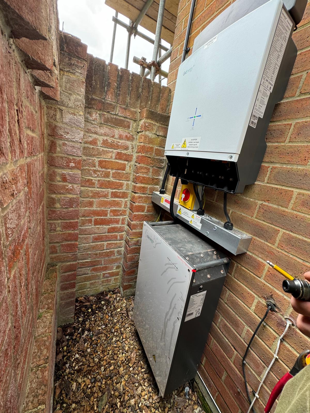 The GivEnergy inverter and battery installed on the side of the property.
